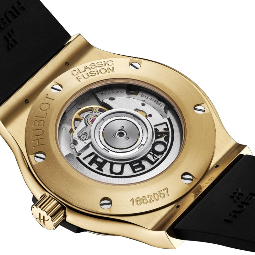 Close-up of the back of the Hublot Classic Fusion Original Yellow Gold, highlighting its 18K yellow gold case, black strap, and the HUB1110 self-winding calibre visible through a transparent caseback.