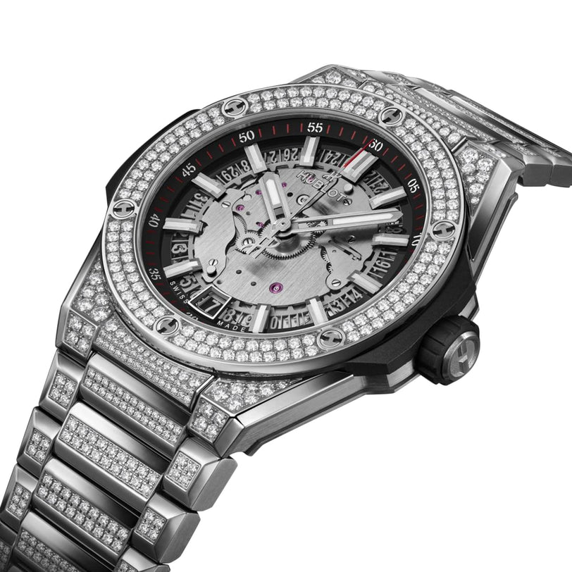 The Hublot Big Bang Integrated Time Only Titanium Pavé is a luxury silver wristwatch with a titanium case, skeleton dial, date display, and pavé-set diamonds on the bezel and bracelet for an exquisite appearance.