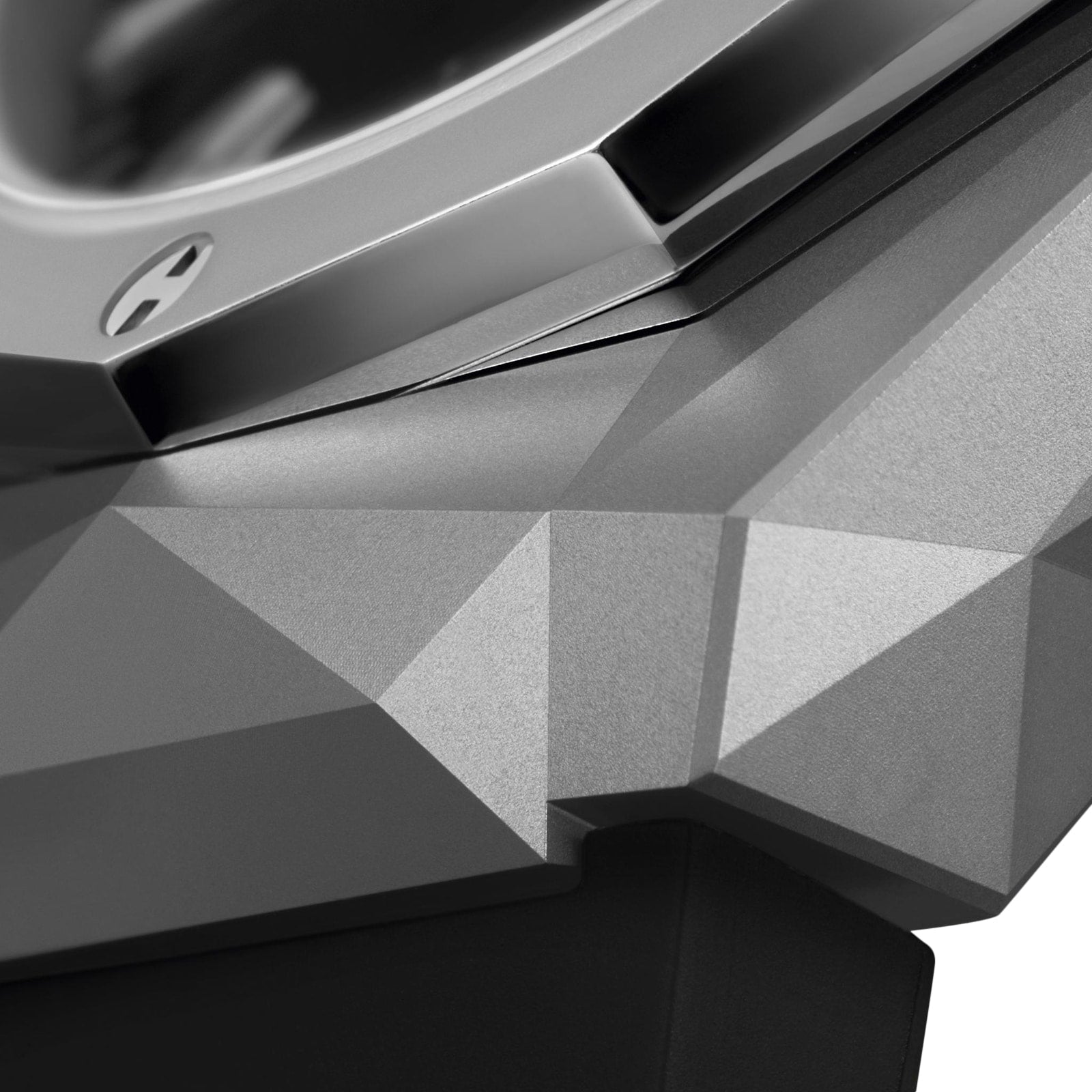 Close-up of the Hublot Classic Fusion Chronograph Orlinski Titanium, featuring a faceted geometric metal case with angular surfaces and a visible screw near the bezel, inspired by Richard Orlinski’s bold design.