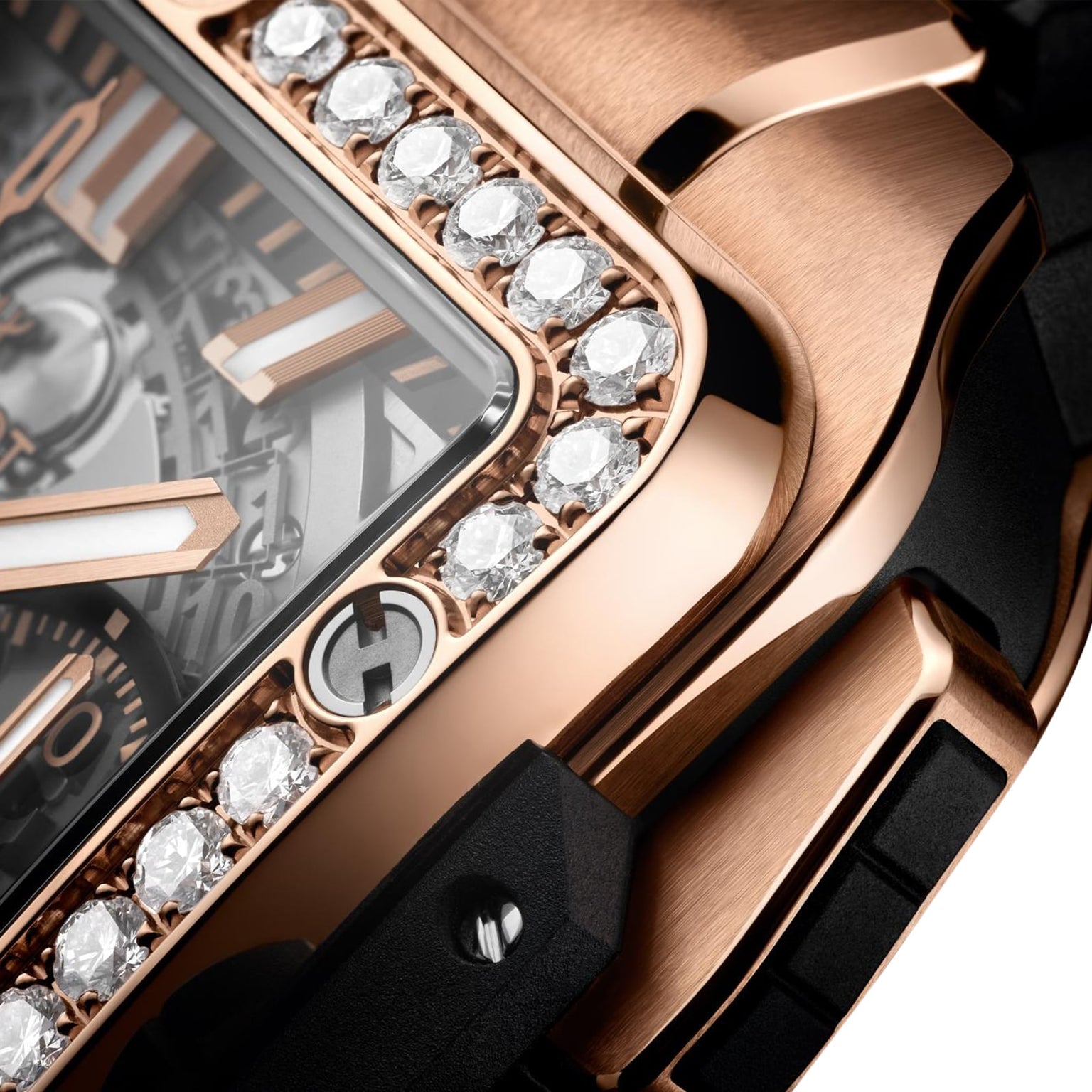 Close-up of the Hublot Square Bang Unico King Gold Diamonds watch, featuring a King Gold case, diamond-set bezel, and visible Unico movement details.