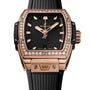 A Hublot Spirit Of Big Bang King Gold Diamonds watch in 18K gold with a diamond-set bezel, black dial, and black rubber strap shows the time as 10:10.