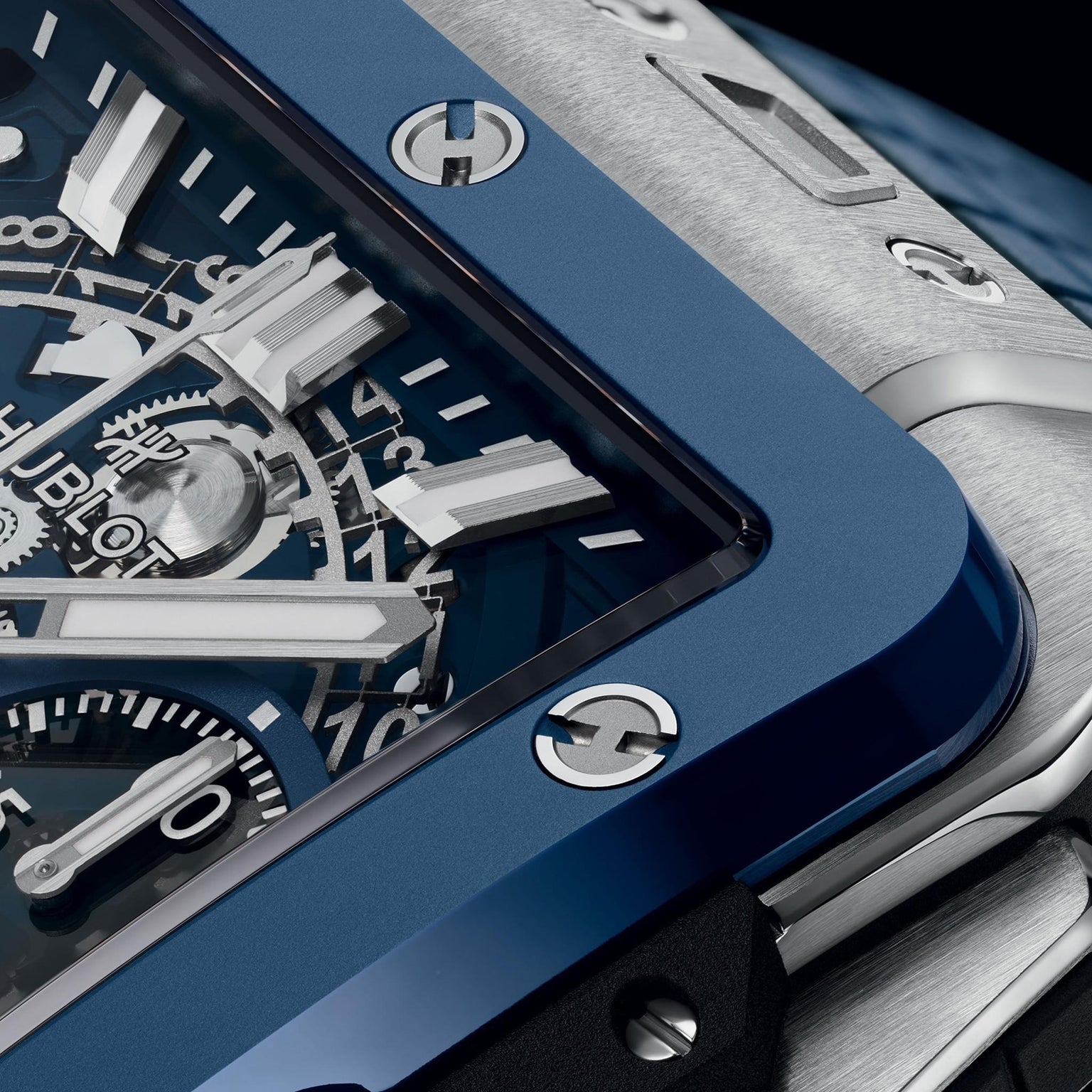 Close-up of the Hublot Square Bang Unico Titanium Blue Ceramic, featuring a blue ceramic bezel, exposed gears, silver hour markers, and intricate mechanics under a sapphire crystal dial.
