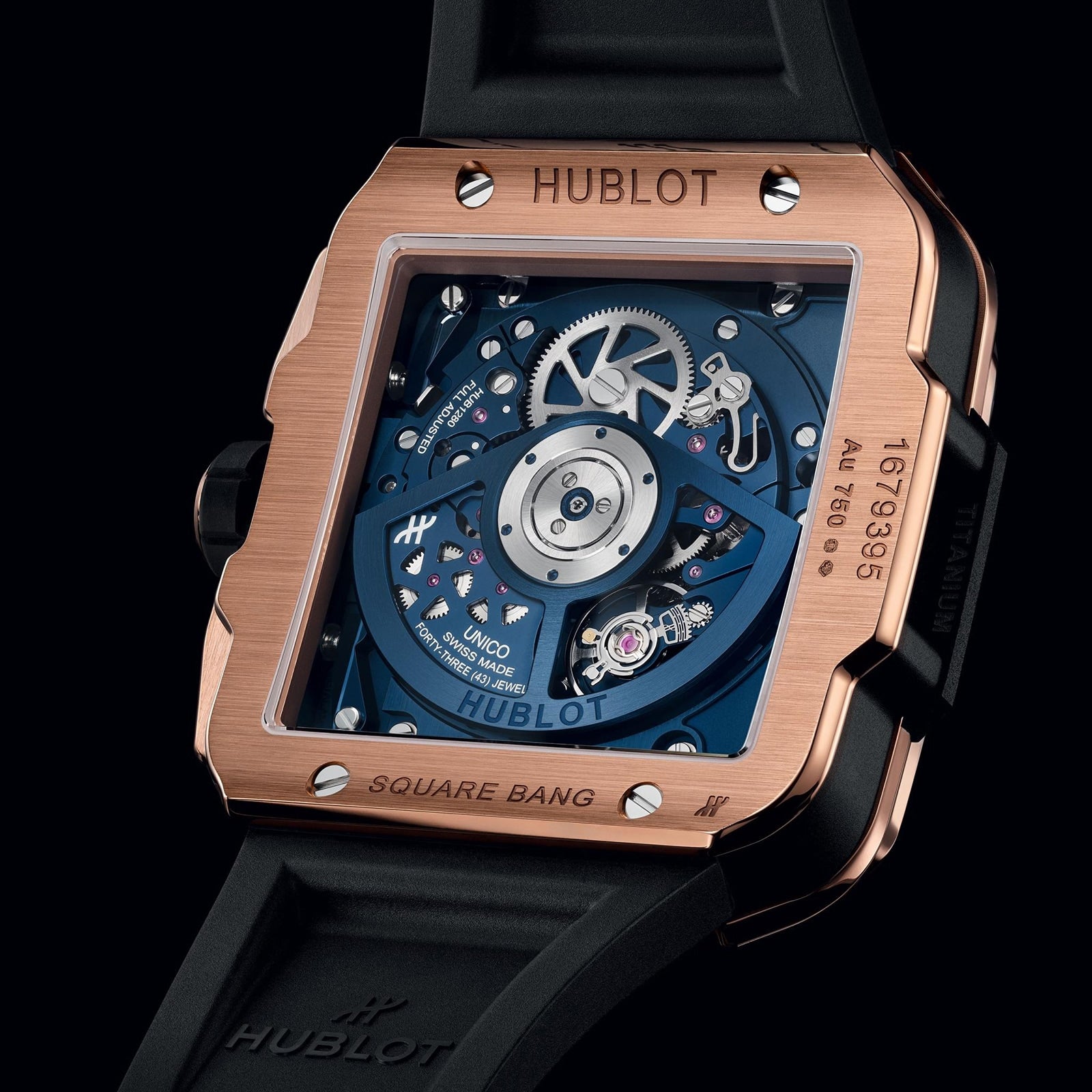 Close-up of the Hublot Square Bang Unico King Gold Blue Ceramic, showcasing its King Gold case, exposed mechanical movement with blue inner plate and inscriptions, paired with a black rubber strap.