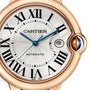 Close-up of the Cartier Ballon Bleu de Cartier watch, featuring Roman numerals, blue hands, date window at 3 o’clock, 18K rose gold case, blue cabochon crown, and self-winding mechanical movement.