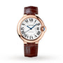 The Ballon Bleu de Cartier by Cartier features a brown leather strap, pink gold case, guilloché dial with Roman numerals, and blue hands.
