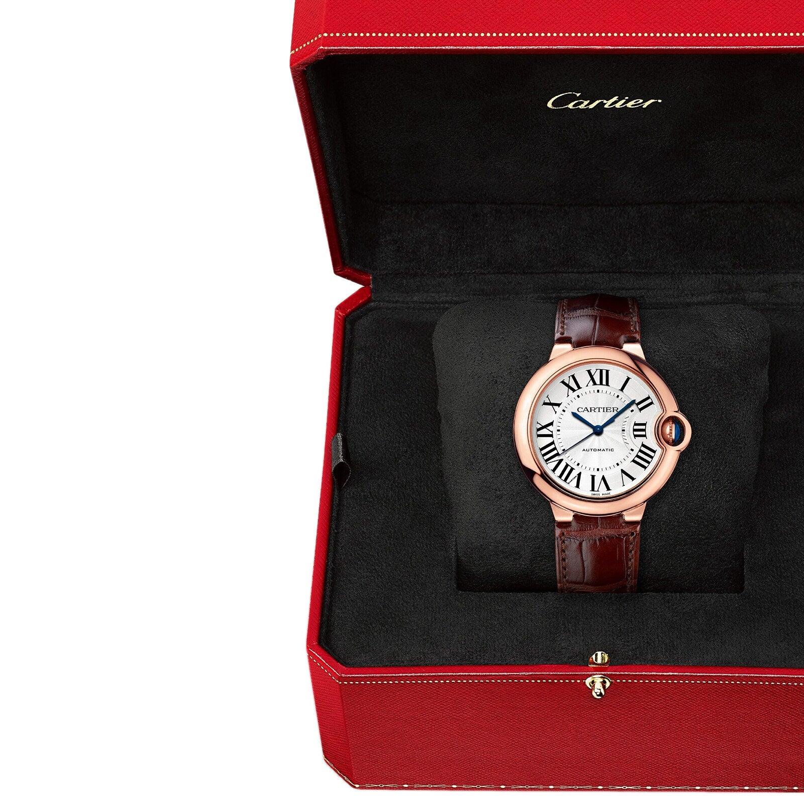 A Cartier Ballon Bleu de Cartier wristwatch with a pink gold case, brown leather strap, and Roman numeral guilloché dial is shown in an open red Cartier box.