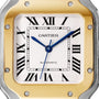 Close-up of a Cartier Santos de Cartier watch face featuring Roman numerals, blue hands, AUTOMATIC text, and a gold and silver bezel with visible screws, highlighting its self-winding mechanical movement.
