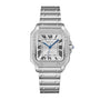 The Santos de Cartier by Cartier is a silver watch with a square face, diamond bezel, Roman numerals, blue hands, a linked metal bracelet with screw details, and automatic winding.