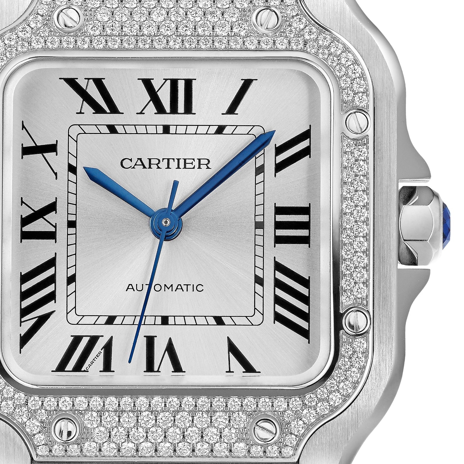 Close-up of the Cartier Santos de Cartier watch with a silver face, blue hands, Roman numeral hour markers, diamond-encrusted bezel, and AUTOMATIC above 6 oclock, highlighting its automatic movement.