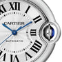 Close-up of the Ballon Bleu de Cartier watch face by Cartier, showcasing blue hands, Roman numerals, Automatic text, a silver guilloché dial, and the signature crown set with a blue cabochon.