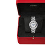 A Ballon Bleu de Cartier watch by Cartier, featuring a silver guilloché dial with Roman numerals and a round face, is displayed in an open red Cartier box with a black interior.
