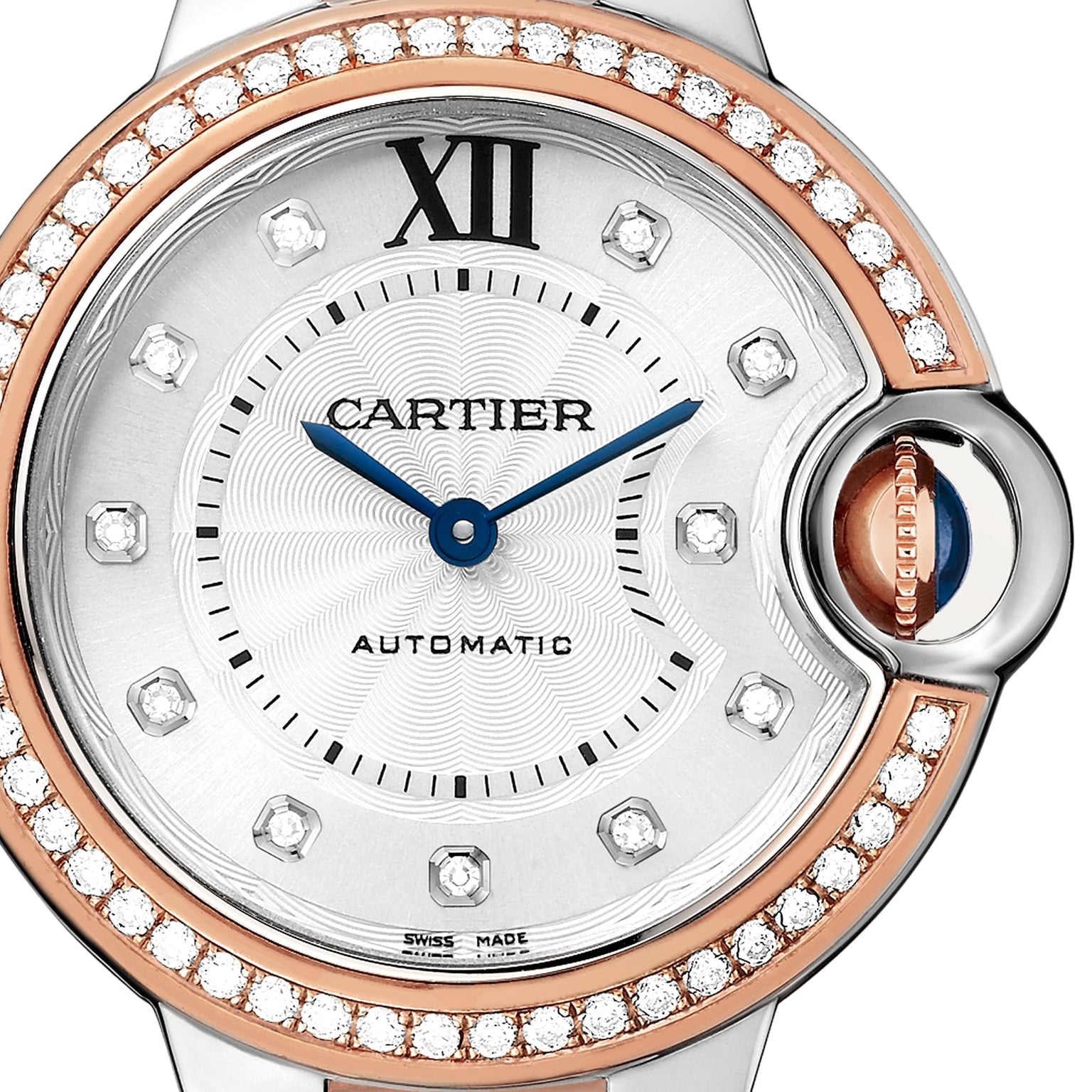 Close-up of the Ballon Bleu de Cartier watch by Cartier, featuring a diamond bezel, rose gold accents, silver dial with blue hands, Roman numeral XII at the top, and a crown set with a signature blue cabochon.