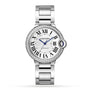 The Ballon Bleu de Cartier by Cartier features a silver round face, Roman numerals, blue hands, a brilliant-cut diamond bezel, and a metal link bracelet.