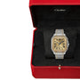A Santos de Cartier Chronograph watch with a two-tone metal band and square face, featuring mechanical movement, displayed in a red Cartier box with black interior.
