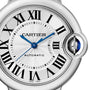 Close-up of the Ballon Bleu de Cartier watch face featuring Roman numerals, blue sword-shaped hands, automatic movement, and a crown adorned with a blue cabochon.