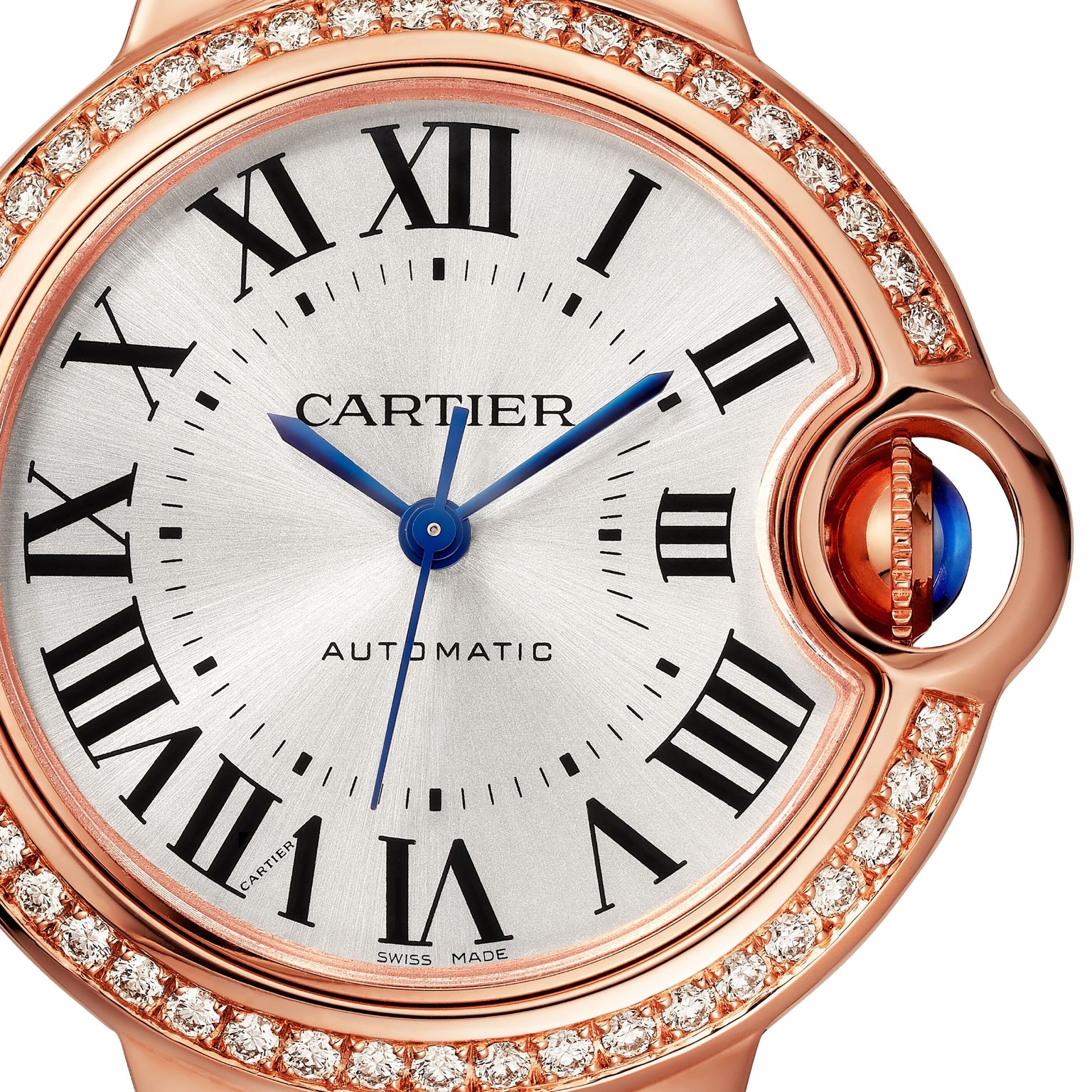Close-up of the Ballon Bleu de Cartier watch by Cartier, featuring Roman numerals, blue hands, a diamond-set rose gold bezel, and a blue cabochon crown. AUTOMATIC is visible on the dial.