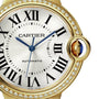 Close-up of the Ballon Bleu de Cartier by Cartier in yellow gold, featuring Roman numerals, blue hands, AUTOMATIC on the dial, and a diamond-set bezel.