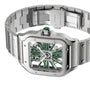 The Cartier Santos de Cartier Skeleton is a stainless steel wristwatch with a square bezel, skeleton dial featuring green accents, an emerald cabochon crown, and precise mechanical movement.
