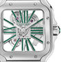 Close-up of the Santos de Cartier Skeleton watch by Cartier, featuring a square case, exposed gears, and green Roman numeral hour markers on its bold skeleton dial.