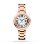 The Cartier Ballon Bleu de Cartier is a rose gold watch with a round white dial, Roman numerals, blue hands, cabochon sapphire crown, and matching link bracelet.