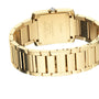 Cartier Tank Américaine wristwatch viewed from the back, highlighting the yellow gold case, clasp, metallic links, and engraved details on the case back.