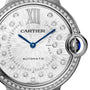 Close-up of the Cartier Ballon Bleu de Cartier watch face featuring a sunray grey dial, blue hands, diamond hour markers, Roman numeral XII, CARTIER and AUTOMATIC text, a blue cabochon crown, and an interchangeable steel bracelet.