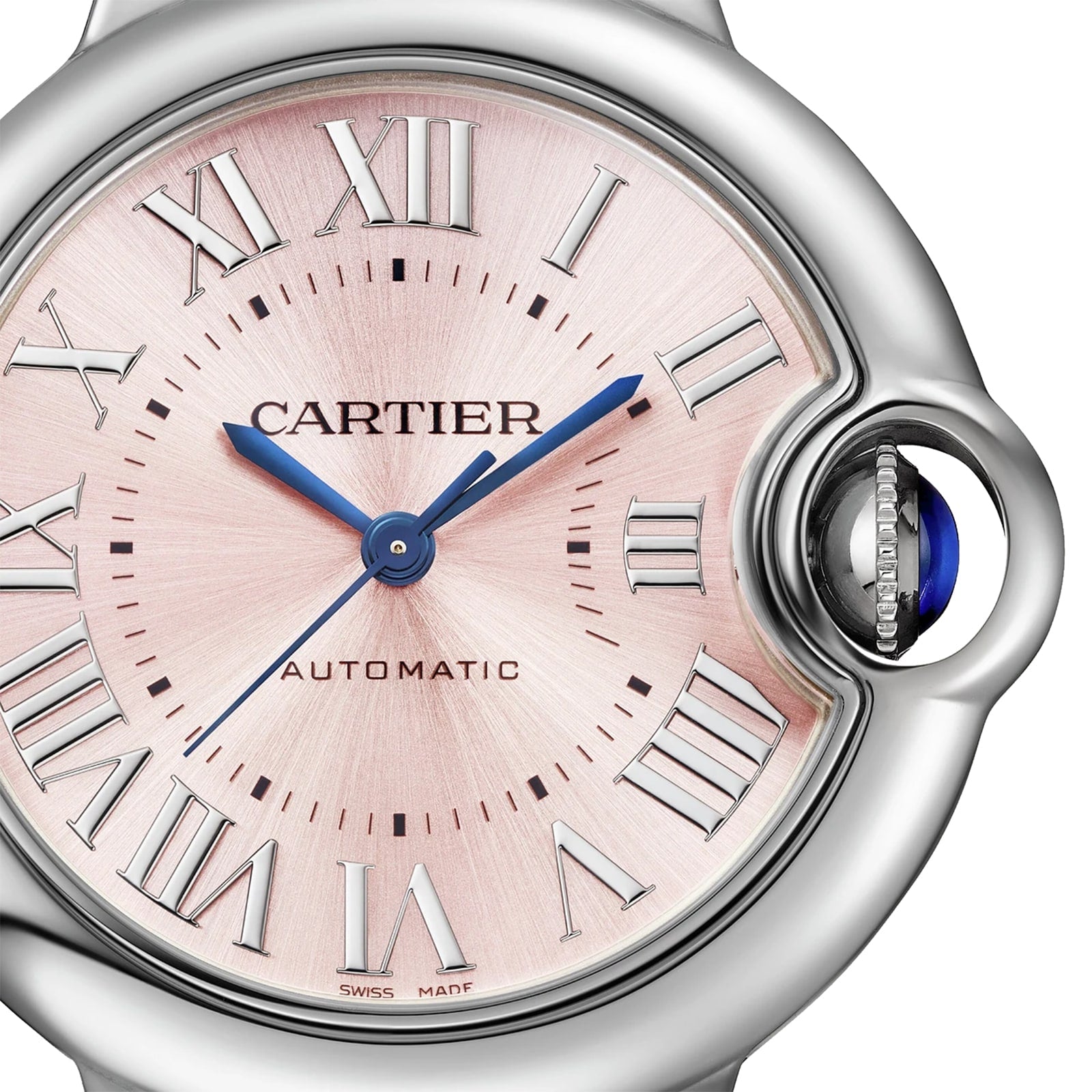 Close-up of a Cartier Ballon Bleu de Cartier watch face featuring Roman numeral markers, blue hands, a pink sunray dial, and a crown adorned with a blue cabochon.