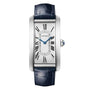 The Cartier Tank Américaine wristwatch showcases a silver face, Roman numeral hour markers, blue hands, and a dark blue leather strap—a true symbol of timeless elegance.