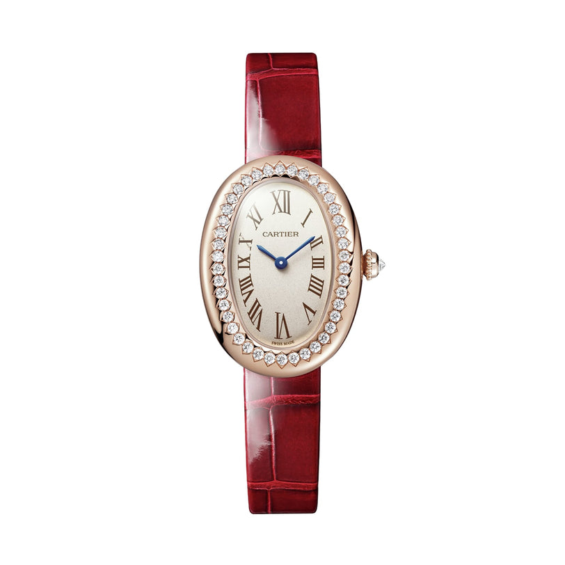 A Cartier Baignoire luxury watch with an oval case, Roman numerals, diamond bezel, silver dial, blue hands, and a red leather strap is displayed on a white background.