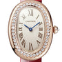 The Cartier Baignoire watch showcases a gold oval case, diamond-set bezel, Roman numerals, blue hands, and a red leather strap—a refined symbol of timeless elegance.