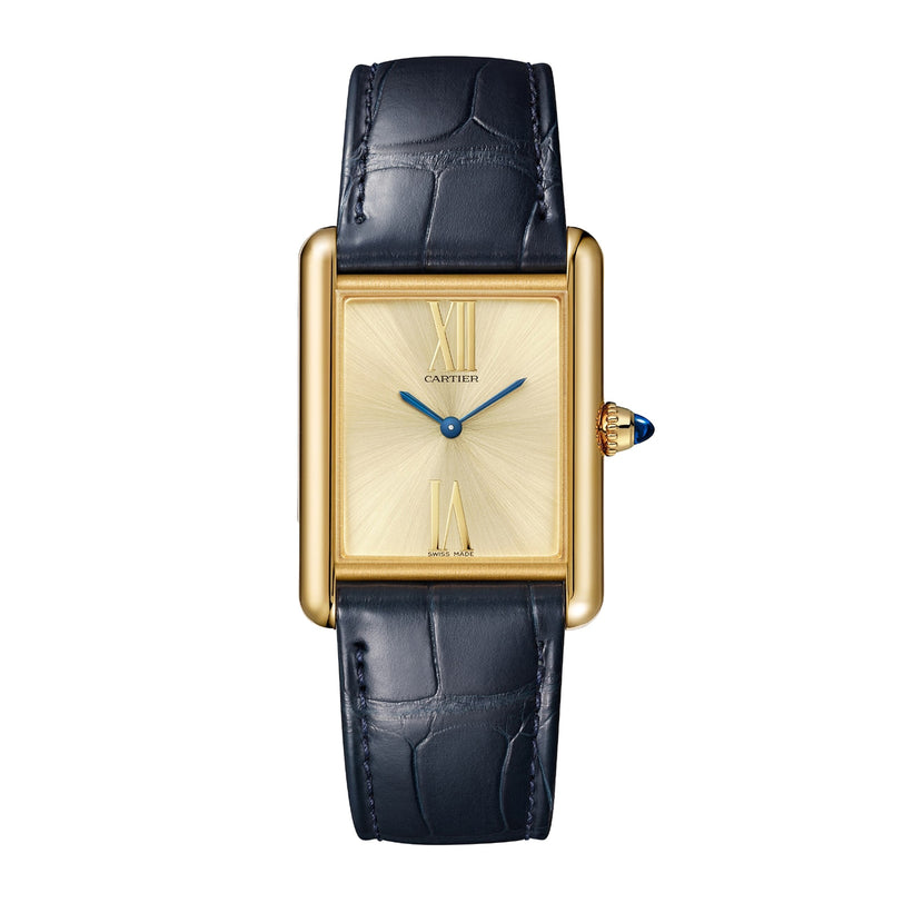 The Cartier Tank Américaine features a rectangular case, sunburst dial, Roman numerals at 12 and 6, blue hands, and a black leather strap—showcasing refined Art Deco elegance.