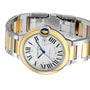 The Cartier Ballon Bleu de Cartier watch features a silver and 18K yellow gold two-tone bracelet, Roman numeral hour markers, a blue cabochon crown, and the Calibre 1847 MC automatic movement.