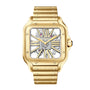 The Santos de Cartier Skeleton by Cartier is a gold square wristwatch with a skeleton dial, exposed gears, Roman numerals, and a metal bracelet.