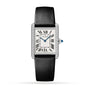 The Cartier Tank Must de Cartier watch features a rectangular case, white dial with black Roman numerals, blued hands, diamond bezel, and a black leather strap.