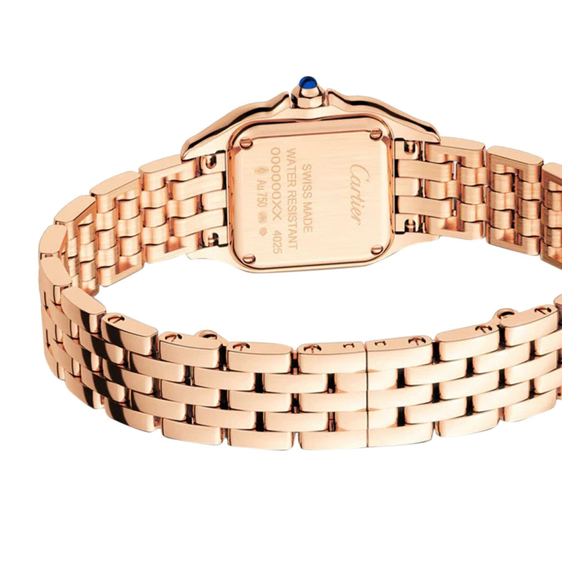 A Cartier Panthère de Cartier Small Model watch in rose gold is shown from the back, revealing its engraved case back, metal link bracelet, and iconic blue sapphire-set crown.