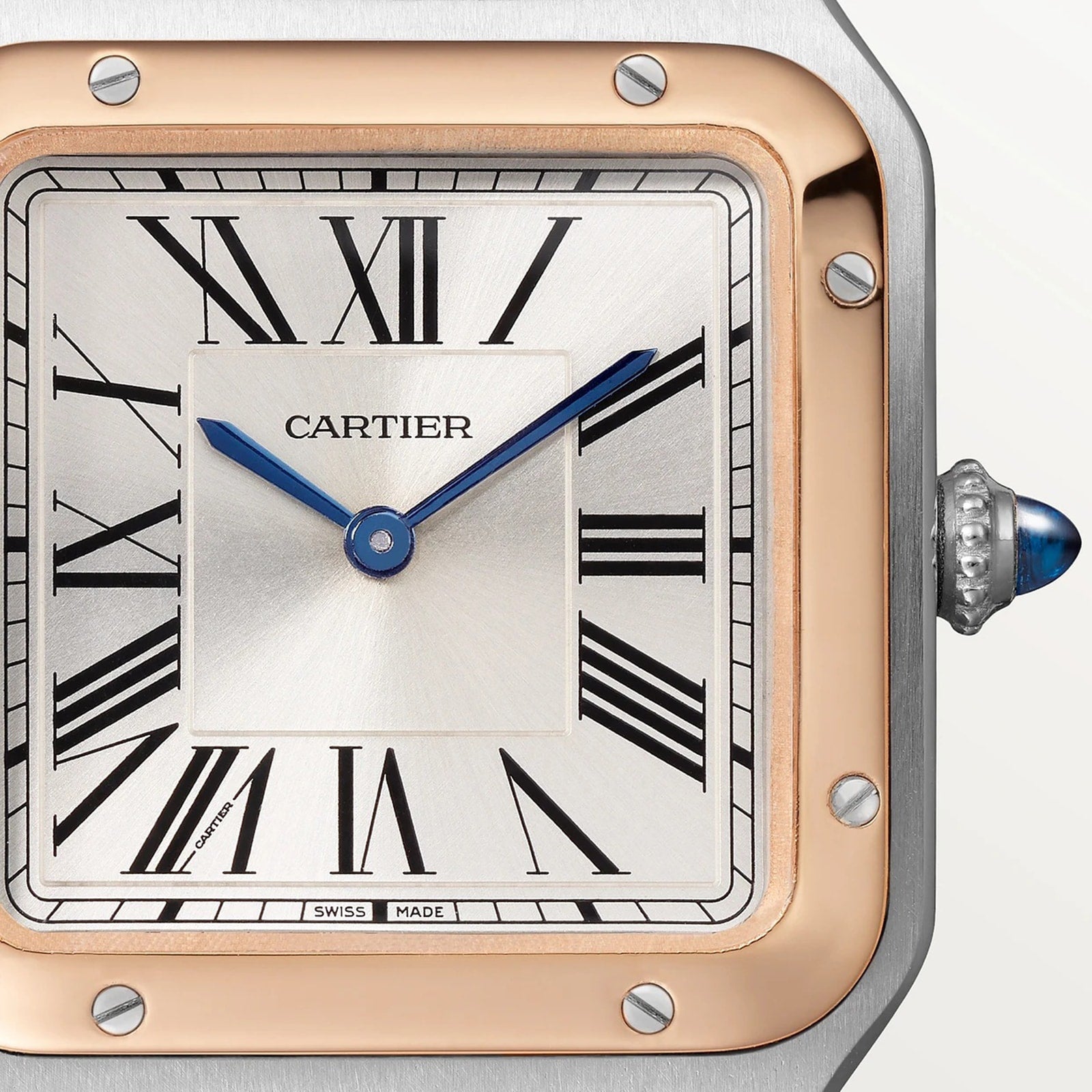 Close-up of a Cartier Santos-Dumont watch face featuring Roman numerals, blue hands, and a gold and silver bezel.