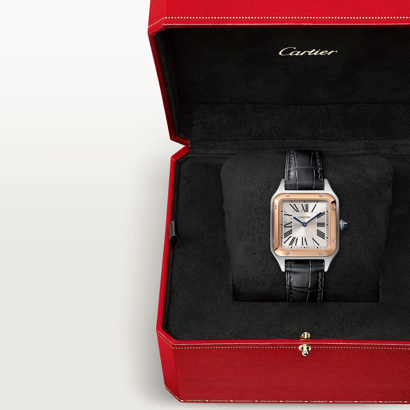 A Cartier Santos-Dumont wristwatch with a black strap in a red Cartier box lined with black velvet.
