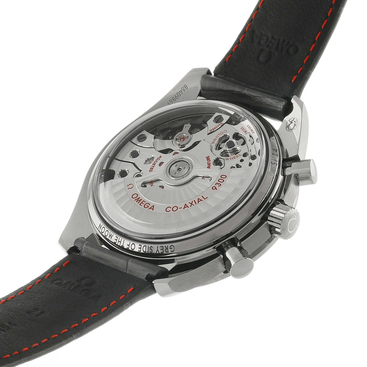 Back view of the OMEGA Speedmaster Dark Side of the Moon Grey Side Edition, showing the exposed Co-Axial calibre 9300 movement and inscriptions on the case and black leather strap with red stitching.