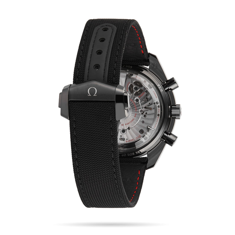 The OMEGA Speedmaster Dark Side of the Moon Black Black is shown from the back, highlighting its transparent case back and textured black strap with red stitching and a metal clasp—a tribute to lunar exploration.