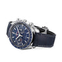 The OMEGA Speedmaster Moonphase, featuring a blue chronograph dial, silver markers, blue leather strap, and Master Chronometer certification, is displayed angled on a white background.
