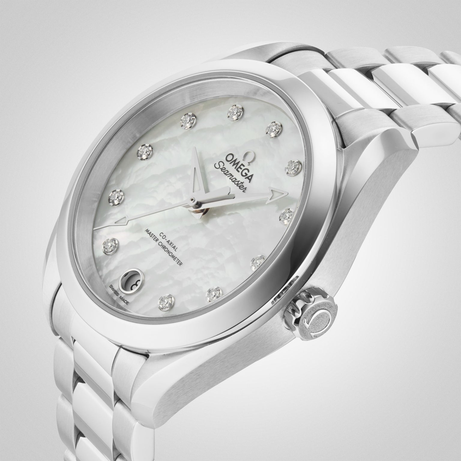 The OMEGA Seamaster Aqua Terra 150M wristwatch, with a metal band, mother-of-pearl dial, diamond hour markers, date display, and precise 8800 calibre movement, is shown at an angle on a light background.