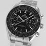 The OMEGA Speedmaster Racing features a stainless steel case, black dial with three subdials, date window, and Liquidmetal™ tachymeter bezel, presented on a metal bracelet.