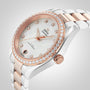 A close-up of an OMEGA Seamaster Aqua Terra 150M watch with a rose gold and silver band, diamond bezel, calibre 8800 movement, and a mother-of-pearl dial with diamond hour markers.
