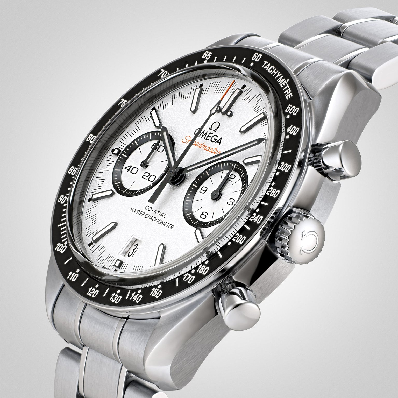 A close-up of the OMEGA Speedmaster Racing watch featuring a stainless steel case, white dial, black bezel, three subdials, and powered by the precise 9900 calibre movement.