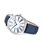 The OMEGA De Ville Tresor 36 is a ladies’ watch with a white dial, blue Roman numerals, a blue leather strap, and a silver case adorned with diamond paving for an elegant touch.