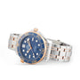 An OMEGA Seamaster Diver 300M wristwatch in silver and rose gold features a blue face, gold bezel markings, and a stainless steel bracelet, shown on a white background.