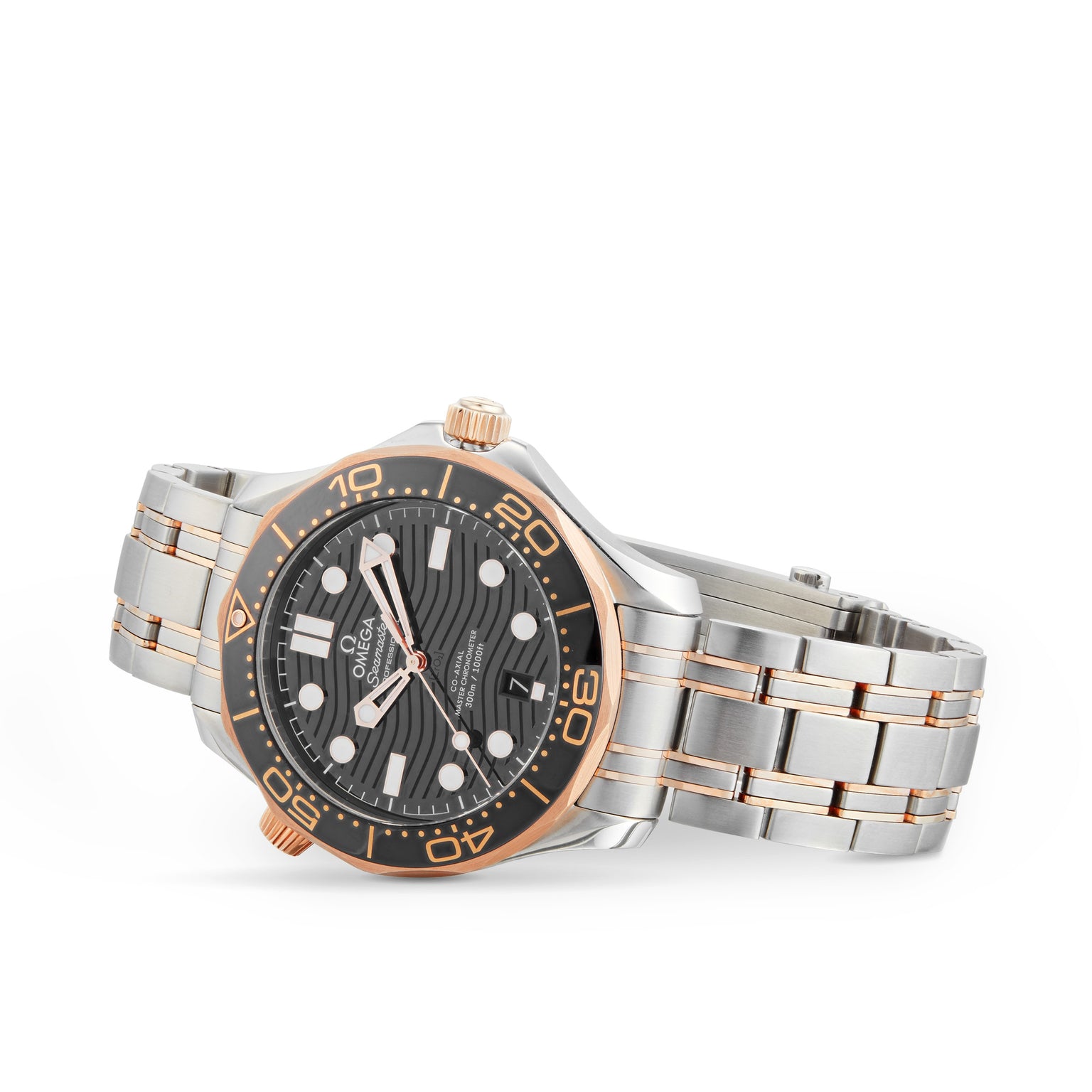 The OMEGA Seamaster Diver 300M wristwatch features a silver and rose gold case, black dial with white markers, and a metal bracelet—an elegant Co-Axial timepiece inspired by James Bonds refined style, shown on a white background.