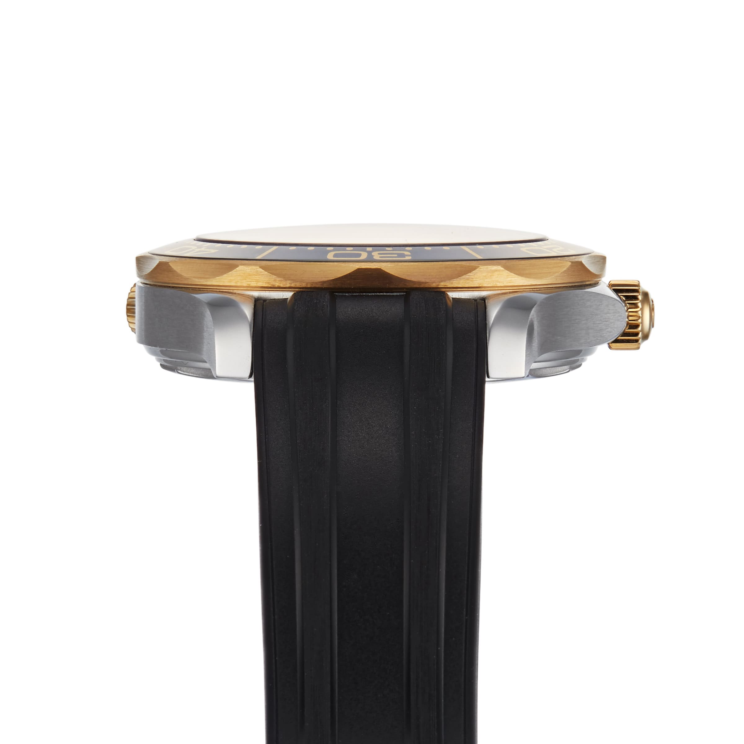 Side view of the OMEGA Seamaster Diver 300M, featuring a gold and silver case, black bezel, and black rubber strap. The right-side crown highlights its Master Chronometer certified Co-Axial calibre 8800 movement.