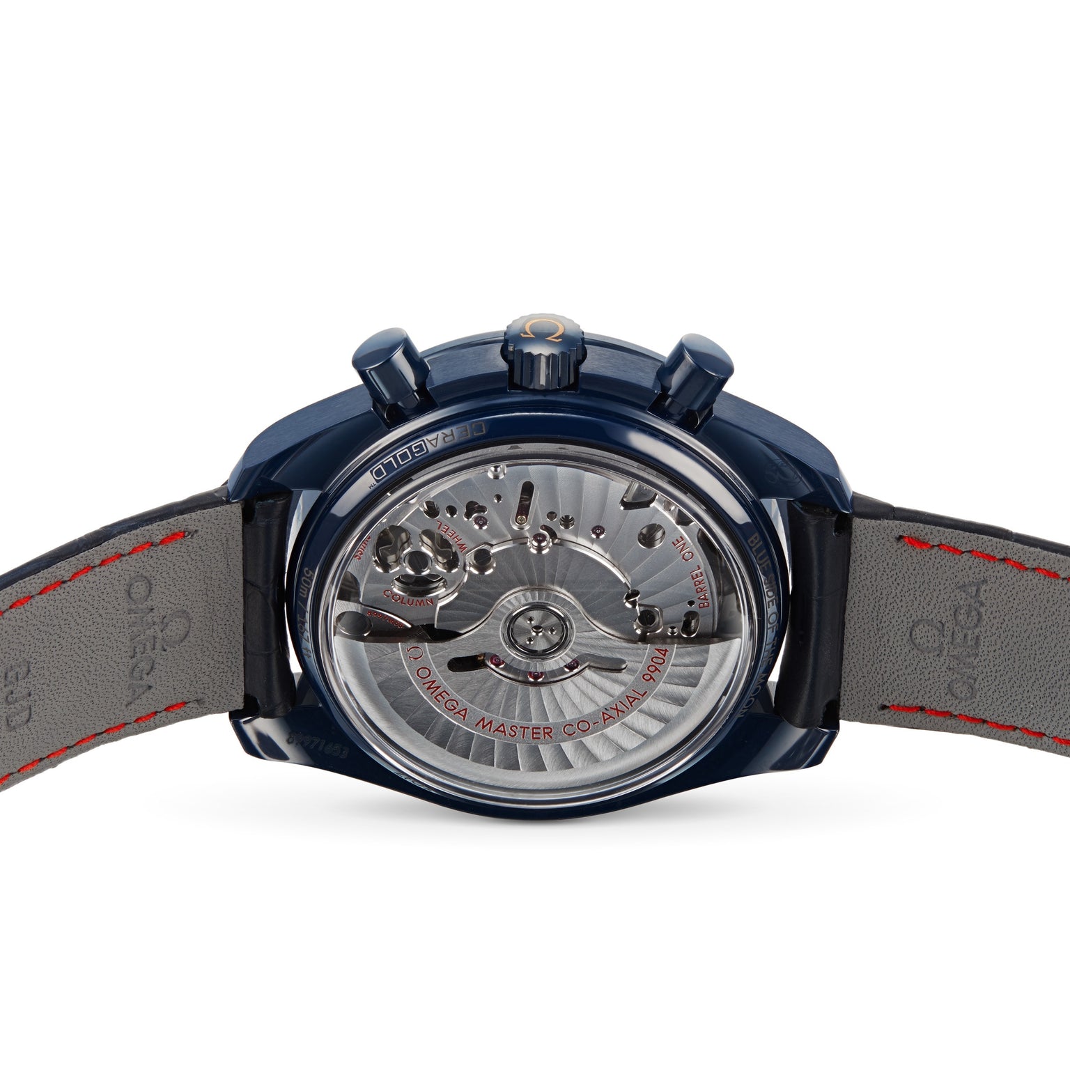 Close-up of the back of an OMEGA Speedmaster 44 Ceramic, with a blue case and transparent back revealing the movement and Master Co-Axial engraving, on a gray leather strap with red stitching.