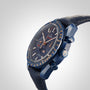 A blue OMEGA Speedmaster 44 Ceramic wristwatch with a dark dial, multiple sub-dials, gold accents, and a leather strap is displayed against a plain white background.